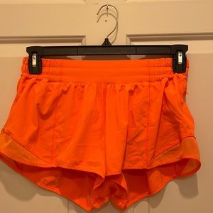 super cute lululemon hotty hot shorts in bright/neon orange! love this color!